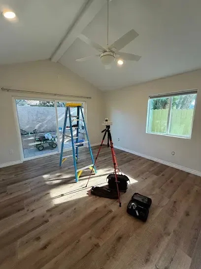 A room cleared out and set up with drying equipment after a water loss