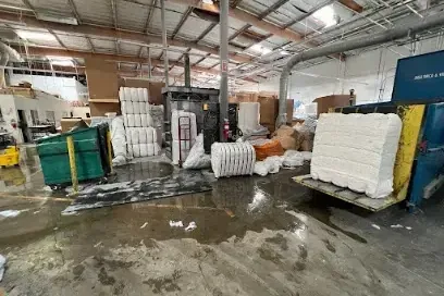 Standing water across a warehouse floor during commercial cleanup